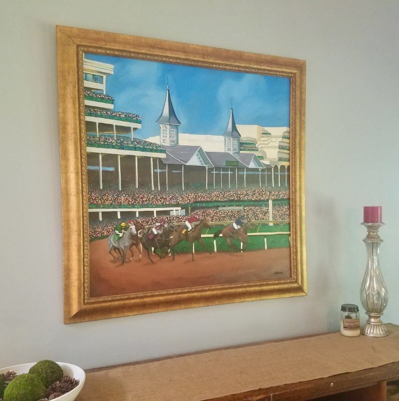 Oil painting of Churchill Downs in gold frame. Marisa Paolucci. The Kentucky Derby